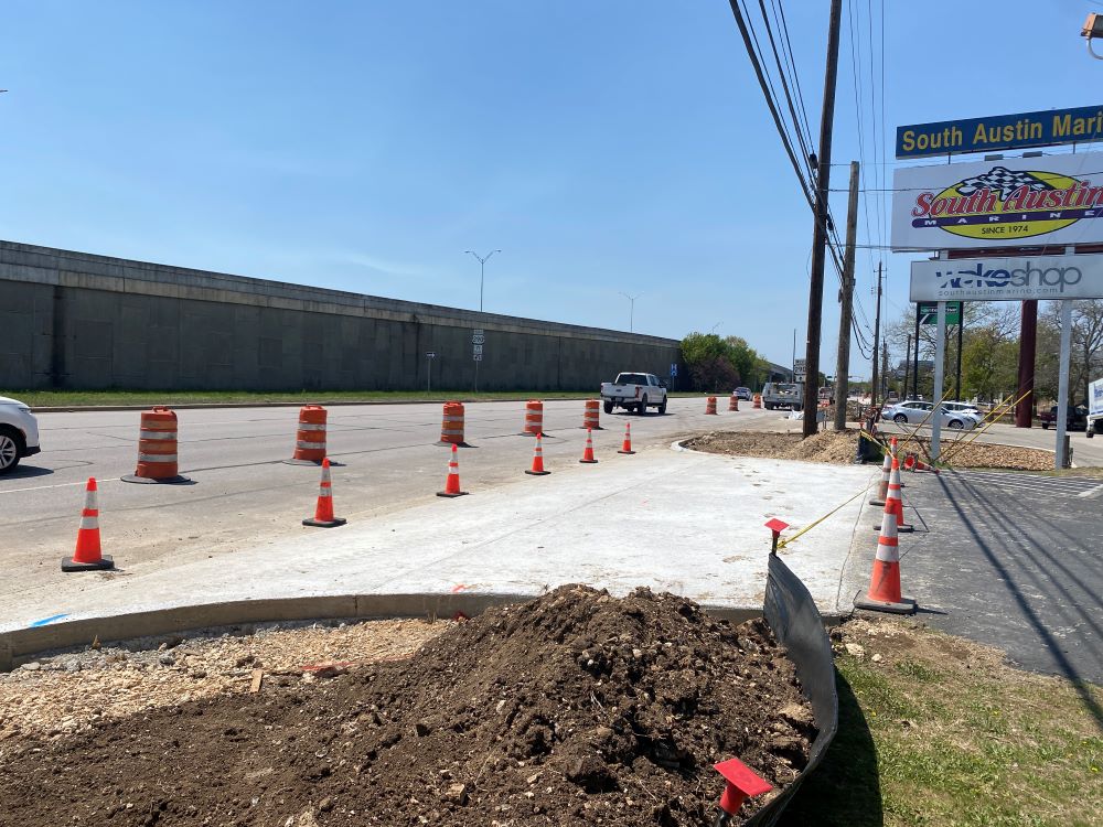 A newly built driveway connects Oak Hill business South Austin Marine to US 290. As shared-use paths are installed throughout the project corridor, many driveways will be re-constructed to meet accessibility standards required by the Americans with Disabi